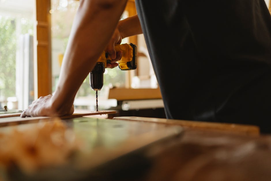 Master carpenter installing custom wood cabinet shelving