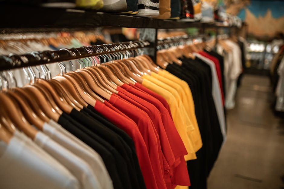 Neatly hanging clothes in a custom designed walk in closet
